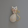 Brooch-pendant Kitty with white mother-of-pearl enamel and rhinestones, gold-tone metal 25x39mm