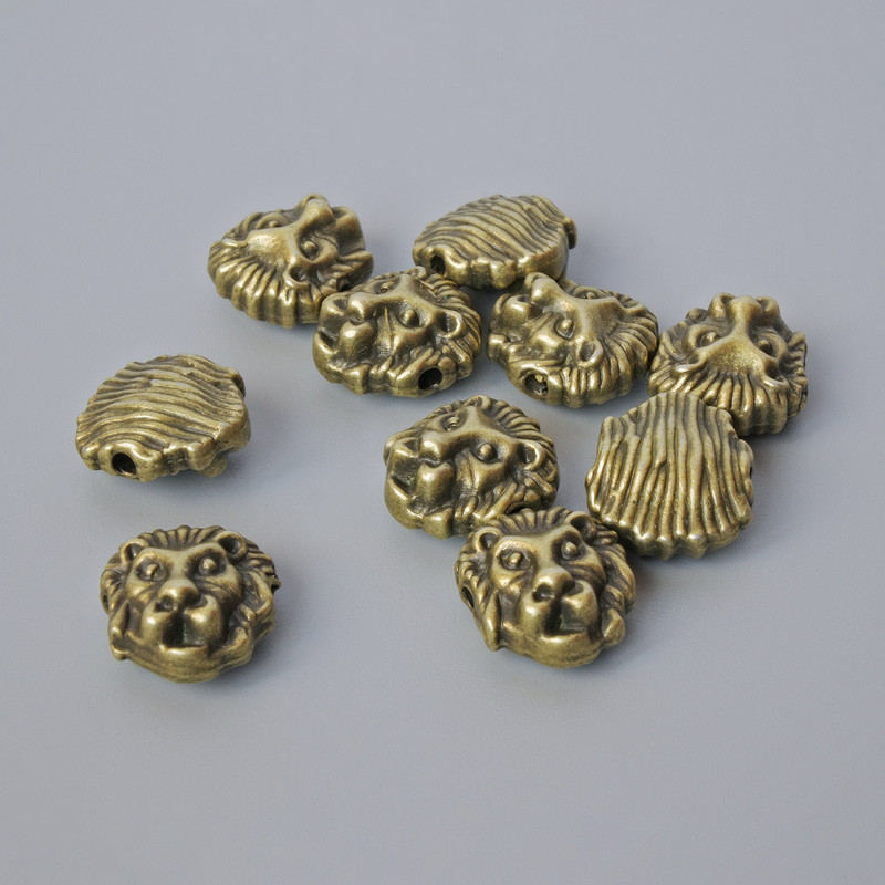 Bead-insert findings 'Lion', size 12x11x6 mm, hole diameter 1.7 mm, pack 10 pcs ± bronze-colored metal