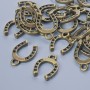 Pendant hardware 'Horseshoe', dimensions 15x11 mm, hole diameter 1.9 mm, packaging 24 pcs ± bronze-colored metal