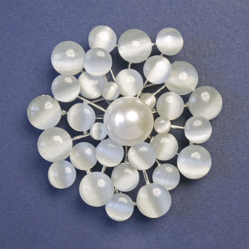 Brooch with gray Cat's Eye stone (synthetic) and pearl (synthetic) 55x55 mm +/- silver-colored metal