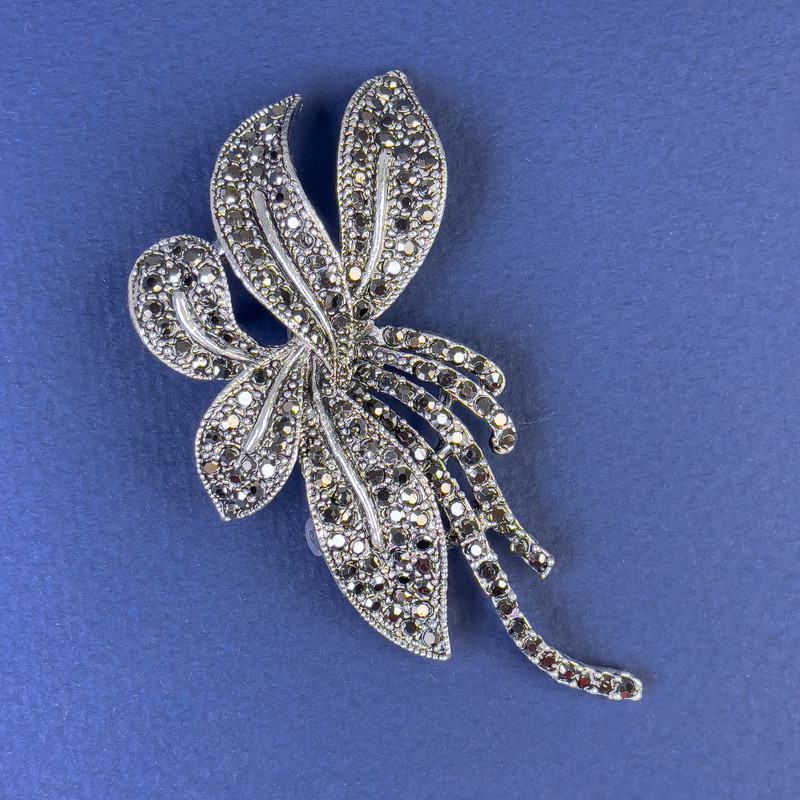 Brooch with gray crystals in dark-silver metal, diameter 70x35 mm +
