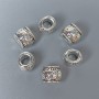 Bead insert, silver metal color, dimensions 9×10×9 mm with through hole ~5 mm, packaging ~20 g (~10 pcs)