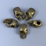 Skull-shaped bead insert, bronze color metal, size 12×18×8 mm ±, hole diameter 4 mm ±, packaging 20 g (~5 pcs)