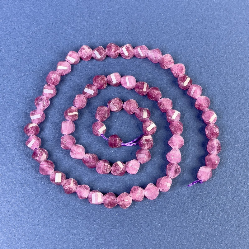 Faceted diamond-shaped tourmaline beads 5x6 mm on a cord, length 38 cm+