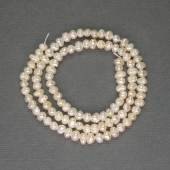 Freshwater white oval pearls on a thread, diameter 3x4 mm ± on thread, length 34 cm ±
