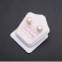 Peach-colored freshwater pearl stud earrings with silver clasp, 7-8 mm diameter