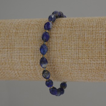 Bracelet with faceted lazurite beads, 8×6 mm diameter ± with 3 mm seed beads ±, 18 cm length, stretch
