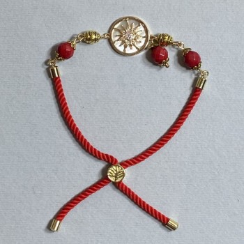 Textile bracelet, 5.5 mm diameter +/-, adjustable drawstring, coral faceted bead 8 mm +/-, with a gold-tone metal insert, 17 mm diameter +/-