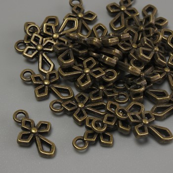 Cross-shaped pendant finding in bronze metal color, size 16 x 10 x 2 mm, hole diameter 2 mm, packaging 20 g (~31 pcs)