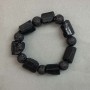 Sherl Tourmaline Bracelet, unpolished stones, faceted cut, diameter 19-27×15 mm ±, lava bead 12 mm ±, length 20 mm ±, stretch