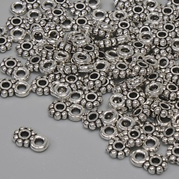 Pendant in silver-colored metal, diameter 7×4.5 mm, bail opening 1.5 mm, packaging 84 pcs