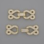 Two-thread clasp with white crystals, diameter 30x12 mm, gold-tone metal