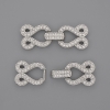 Two-strand clasp with white crystals, 30x12 mm, silver-colored metal