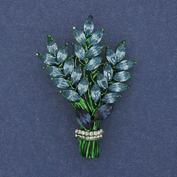 Brooch 'Twig' with blue and white rhinestones, gold-tone metal, 43×29mm +