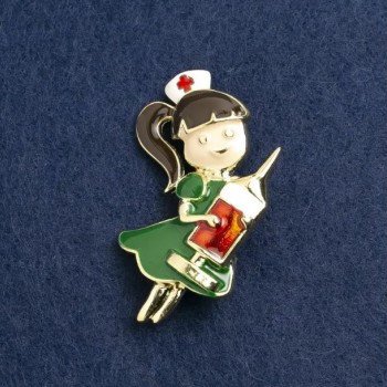 Brooch 'Nurse' enamel green and red, gold-tone metal 44×25mm