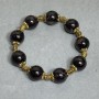 Garnet bracelet with smooth round beads 13 mm, metal inserts, length 18 cm ± stretch