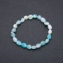 Браслет із натурального каменю Аквамарин на резинці галтування, діаметр 7х9(+-)мм обхват 18см
