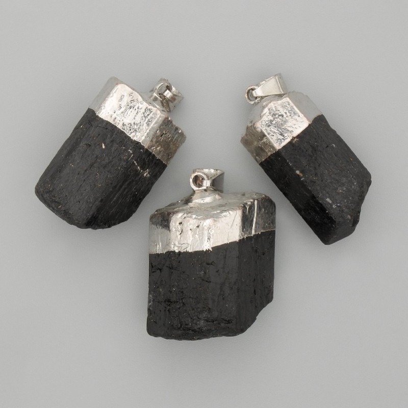 Pendant with unpolished tourmaline stone, diameter approximately 28x18 mm, length 45 mm+