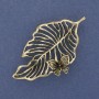 Leaf with butterfly brooch pendant, golden metal, 61×35 mm+