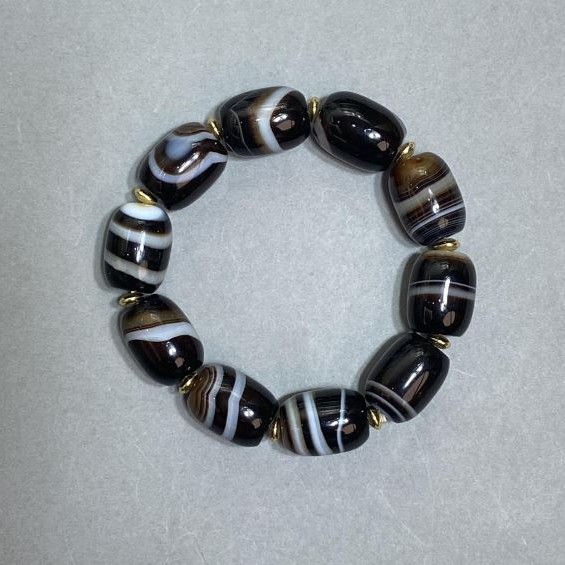 Agate barrel-shaped bracelet 19x15 mm ± with metal inserts, length 18 cm ± stretch