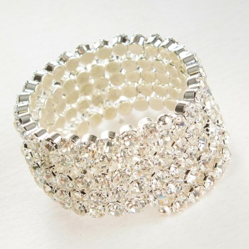 Spiral bracelet with five turns, white rhinestones, circumference 18-22 cm
