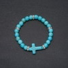 Turquoise bracelet, 8 mm diameter ±, cross insert 24×18 mm ±, circumference 18 cm on elastic