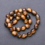 Beads on Thread - Natural Tiger's Eye - Faceted, Diameter 9–12×8 mm, Length 38 cm