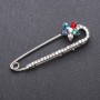 Brooch pin with multicolored glass crystals, 64x19 mm, white metal