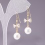 Earrings 'Bows' with White Beads, diameter 10 mm, length 3 cm, yellow metal