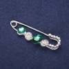 Mini brooch pin with white crystals, green stones, 50x15 mm, silver-colored metal