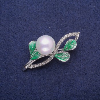 Brooch 'Twig' with enamel, rhinestones and pearl, silver-toned metal 27x48mm