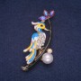 Brooch 'Bird on a Branch' with Enamel and Crystals, gold-tone metal 34x60 mm
