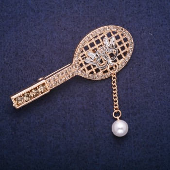 Brooch 'Racket' with a bead pendant in gray rhinestones, gold-tone metal 24x64