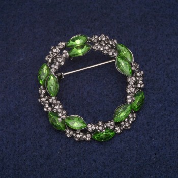 Brooch 'Wreath with green crystals and white rhinestones', gray metal 36x37 mm