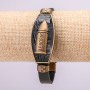 Bracelet with metal inlays, 21 cm long, 20 mm thick, eco leather, black, with a clasp