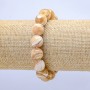 Elastic bracelet with natural beige mother-of-pearl. Smooth bead, 10 mm diameter, 18 cm length