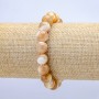Elastic bracelet with natural beige mother-of-pearl. Smooth bead, 10 mm diameter, 18 cm length.