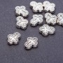 Bead findings: Cross bead, 14×12 mm, hole diameter d mm, metal color 'silver', pack. 20 g +/- 10 pcs
