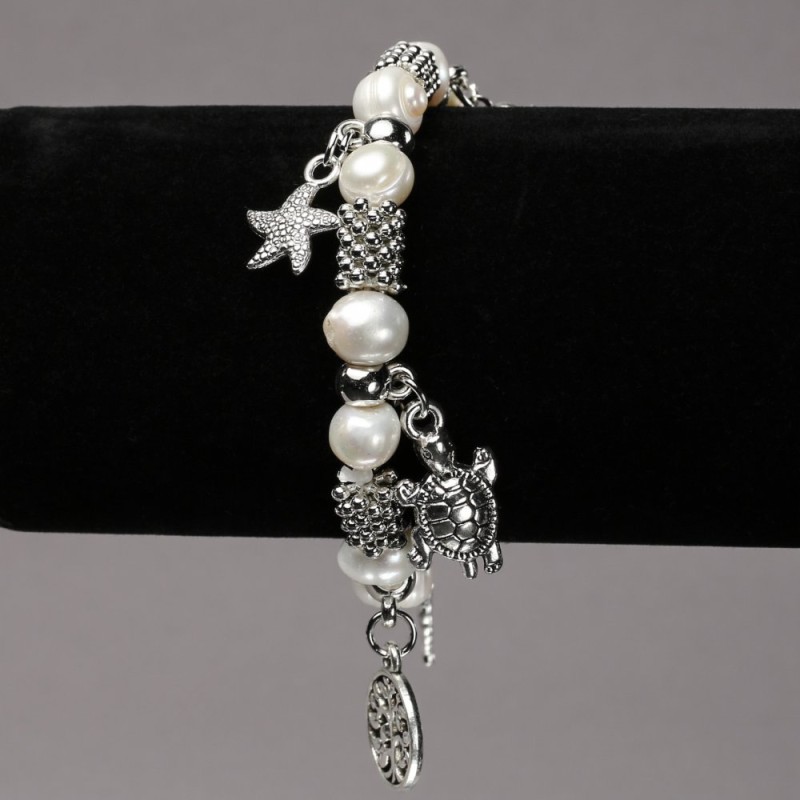 Elastic bracelet with freshwater pearls, silver inserts and pendants, diameter 8-10 mm, length 18 cm