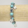 Turquoise bracelet (imitation) on elastic, 10 mm diameter ± with silver palm inserts and pendants, length 18 cm+