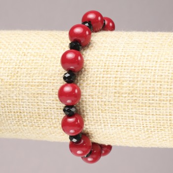 Elastic bracelet with coral (synthetic) smooth beads, diameter about 10 mm ± with black faceted glass 'disc' 6x4 mm