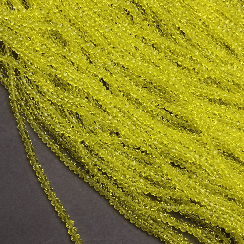 Yellow transparent faceted Czech crystal rondelle beads on thread, diameter 3x2.5 mm, length 36-38 cm