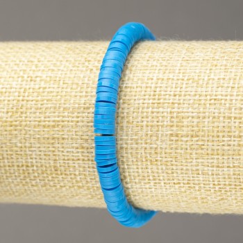 Blue elastic bracelet with round flat polymer clay beads