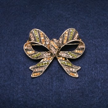 Brooch 'Accent Bow' 55x45mm with crystals, green and yellow, gold-tone metal