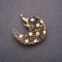Brooch with pink rhinestones 42x42mm in yellow metal