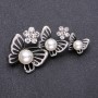 Brooch: Butterfly garland with white beads, 65x32 mm metal
