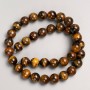 Beads on natural Tiger's Eye thread, diameter 10mm +-, length 38cm +-