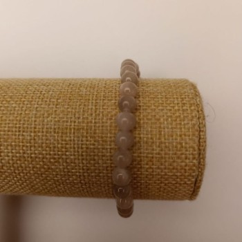 Elastic bracelet with tinted quartz (artificial acrylic) gray smooth beads, 6.5 mm diameter, length 18 cm