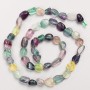 Beads on a thread of natural fluorite, tumbled, 8x9 mm, length 40 cm