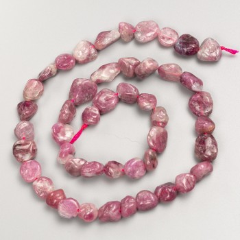 Beads of natural rubellite tourmaline, faceted on a thread, diameter 9x9mm+-, length 42cm+-